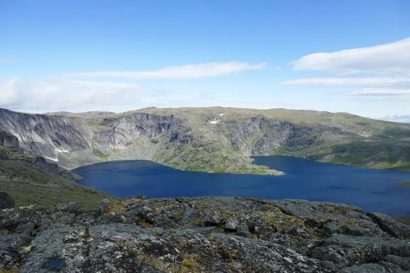 A lake below rocky cliffs in the Mealy Mountains, Labrador